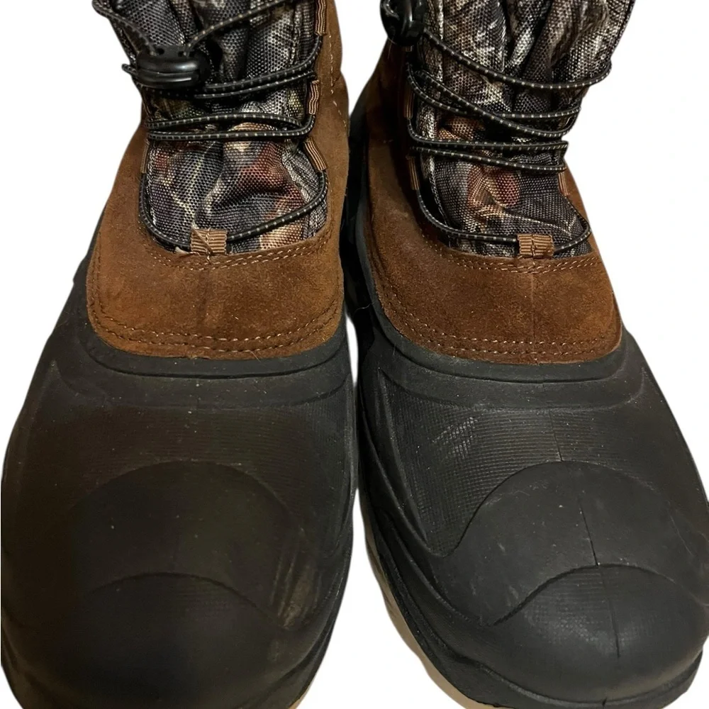 Ozark Trail Men's Winter Pac Boots with a Mossy Oak camouflage and suede upper.